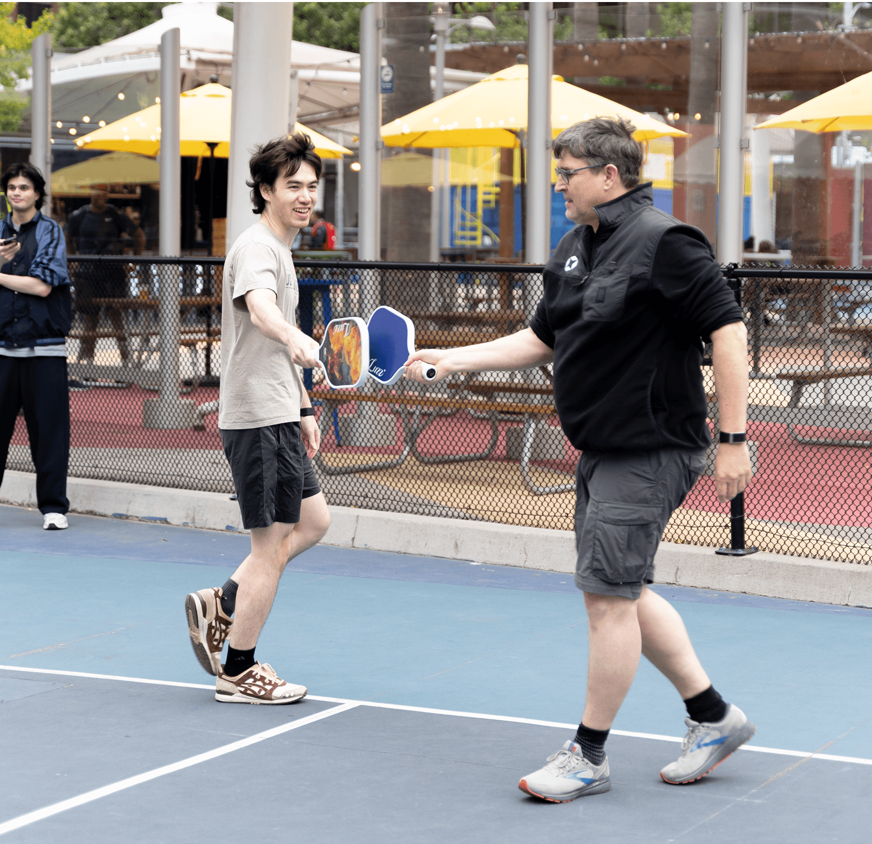 Co-founder, Chris, and ML Engineer, Joachim, playing pickleball together.